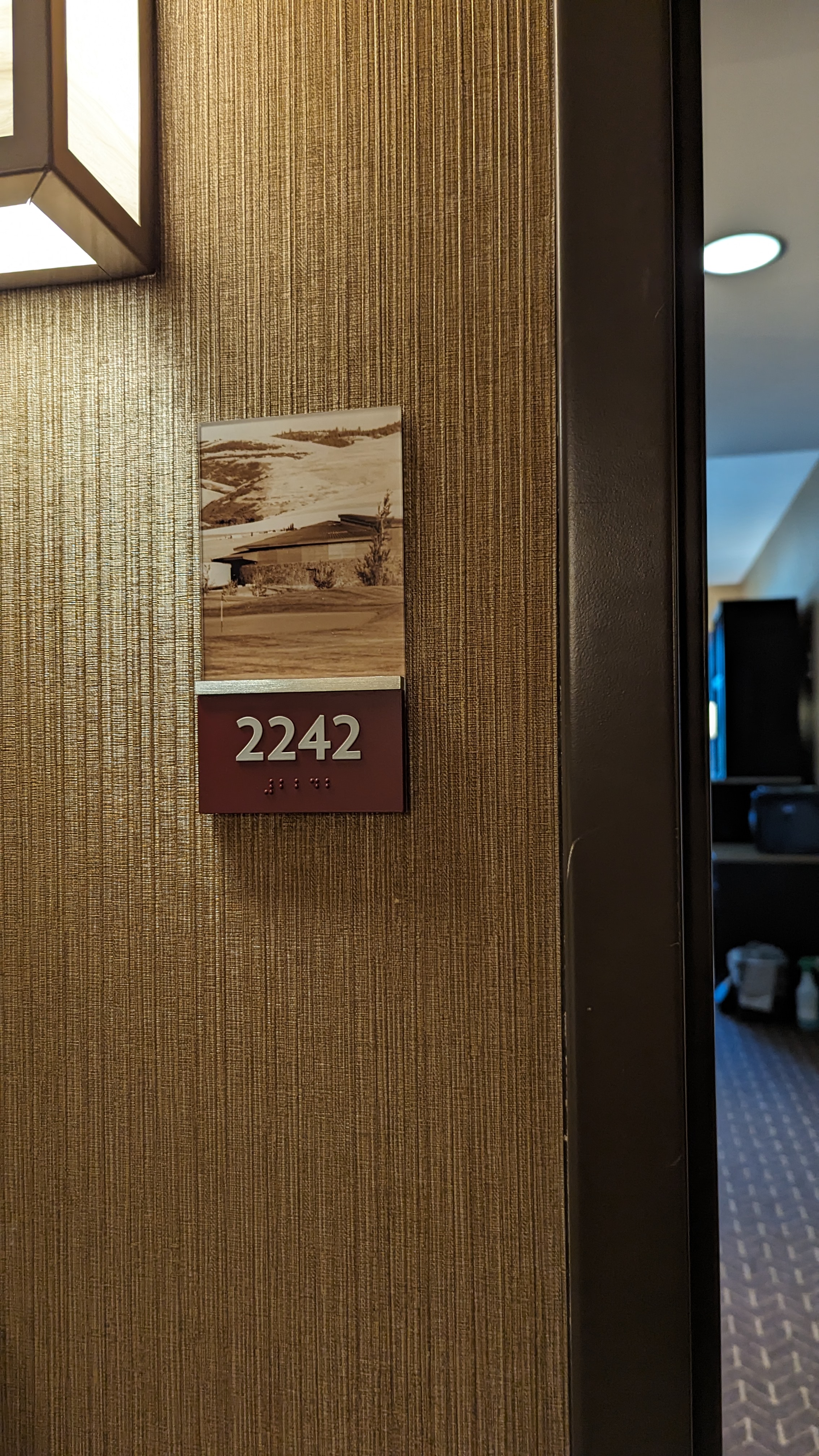 Room number sign with braille
