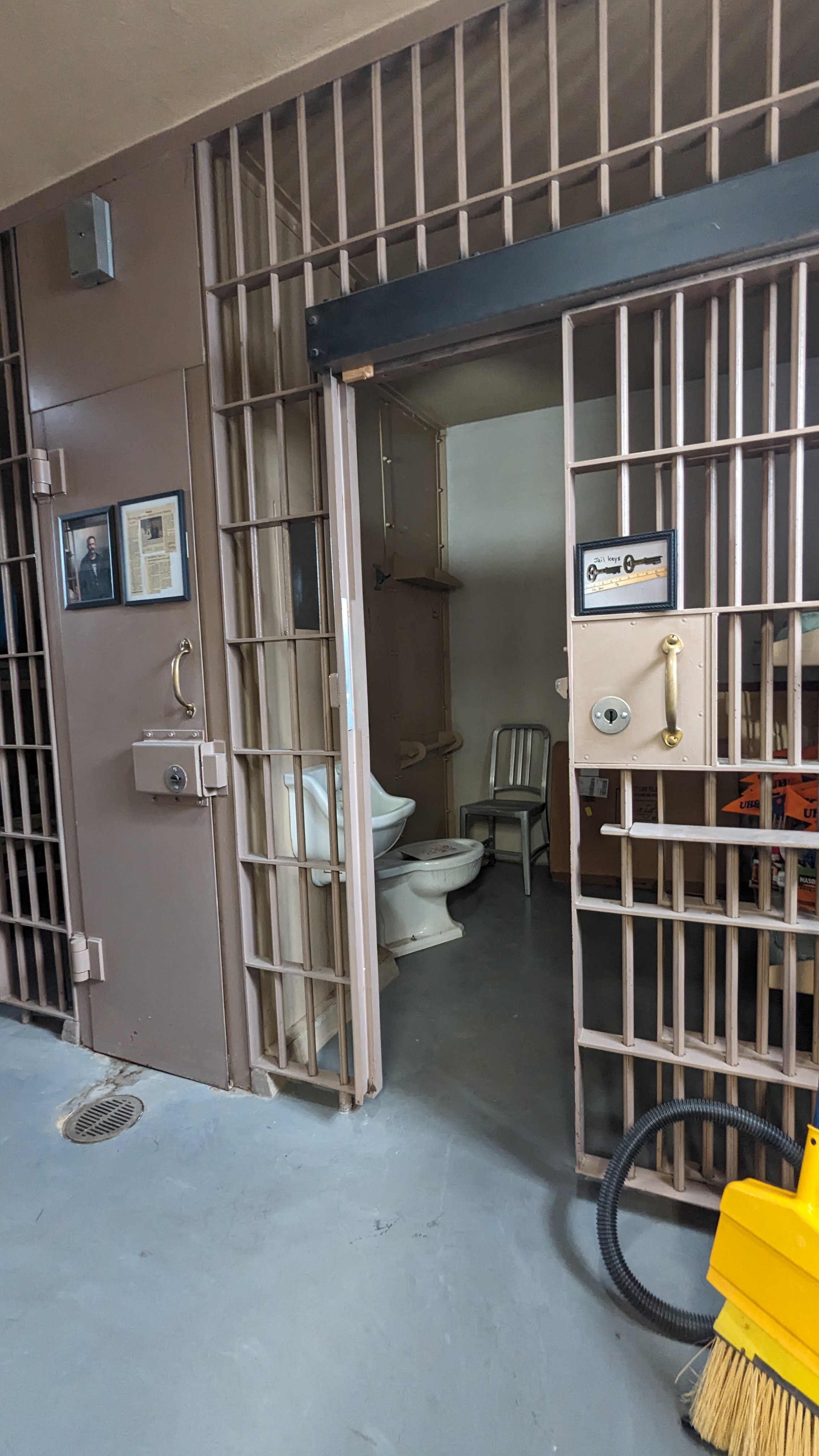 Old jail cells, doors open to 32