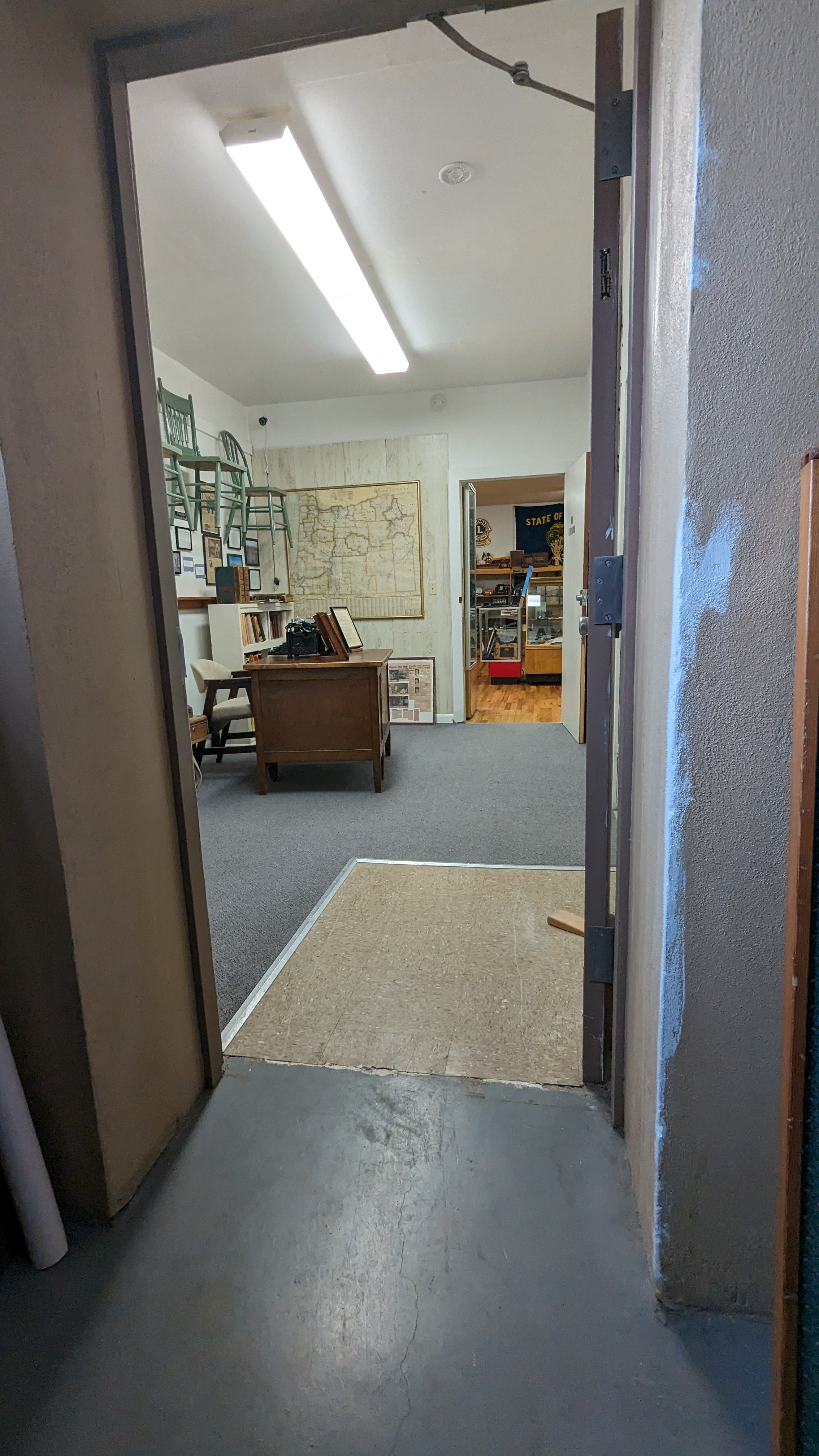 From jail cells doorway to room where outdoor ramp entrance comes in.