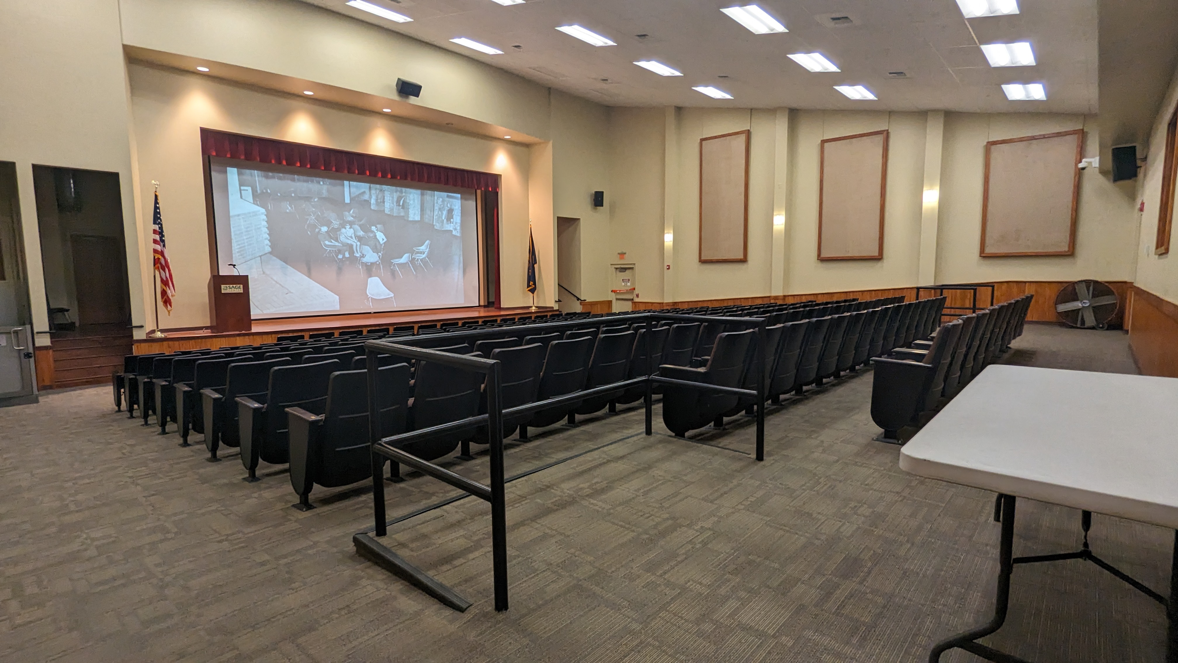 Theater stage with ADA seating above and below, lift up front on left to get on stage.