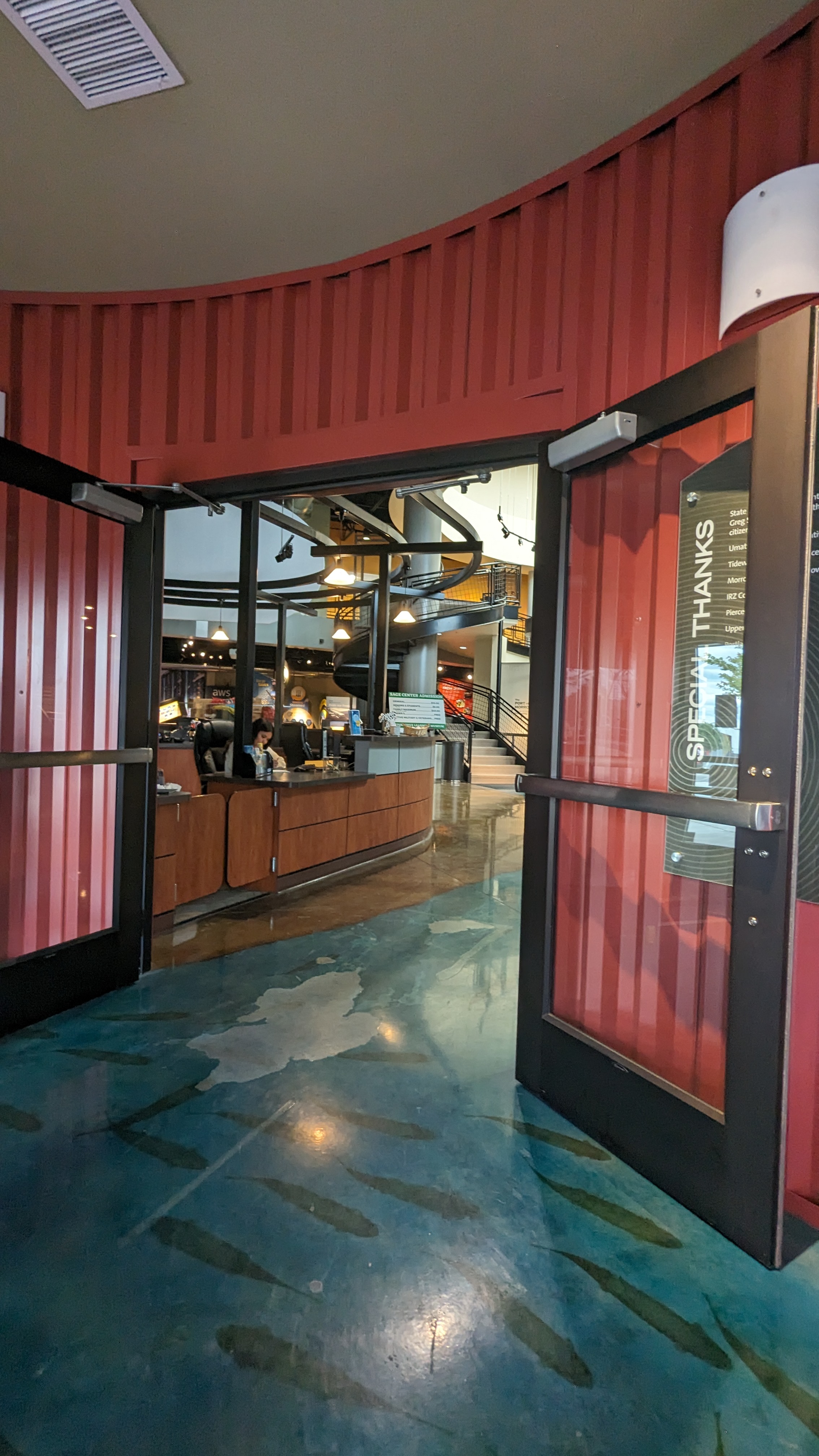 Second set of doors stay open at entry and open to lower front desk.